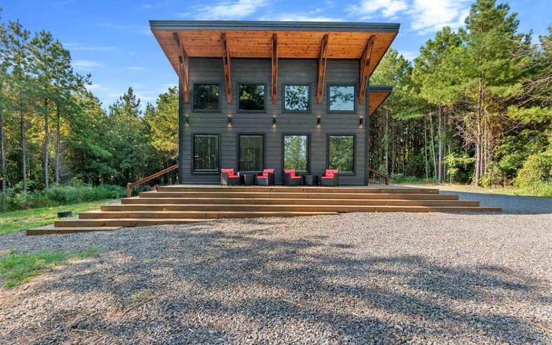 Cedar & Steam, a romantic Broken Bow cabin surrounded by pine trees